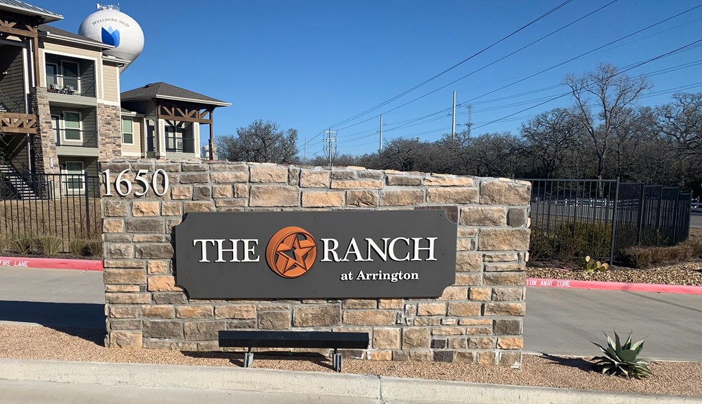 the sign at the entrance to the ranch