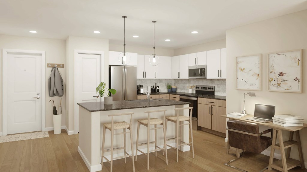 A kitchen with a bar area and a dining table.