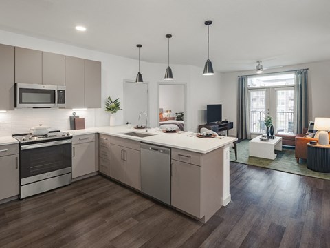 a kitchen and living room in a 555 waverly unit