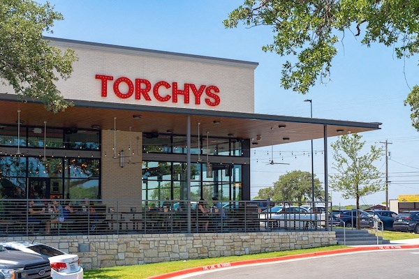 a restaurant with a sign that reads ``troughs' on the front of it