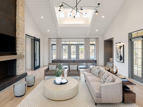 A modern living room with a fireplace and a large couch.