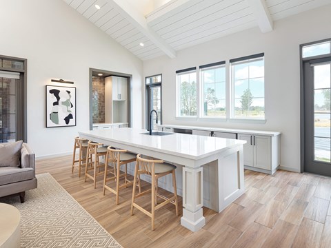 A kitchen with a bar area and a couch.