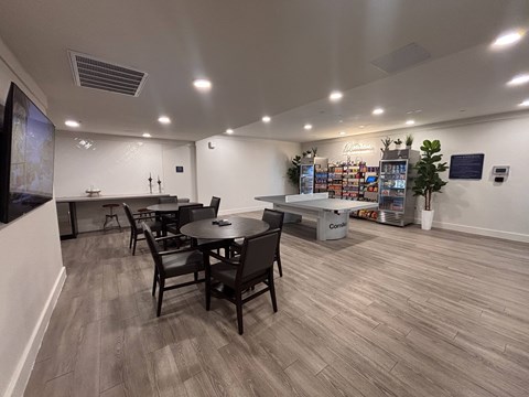 A room with a table and chairs in it.