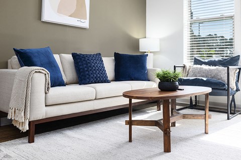 a living room with a couch and a table