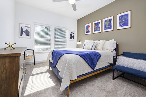 a bedroom with a bed and a desk