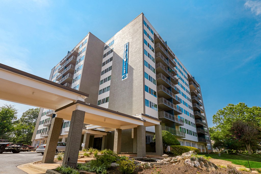 front view of the building with parking lot and landscaping