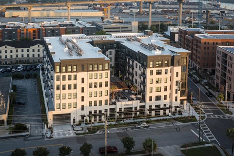 A city street with a large building in the middle.