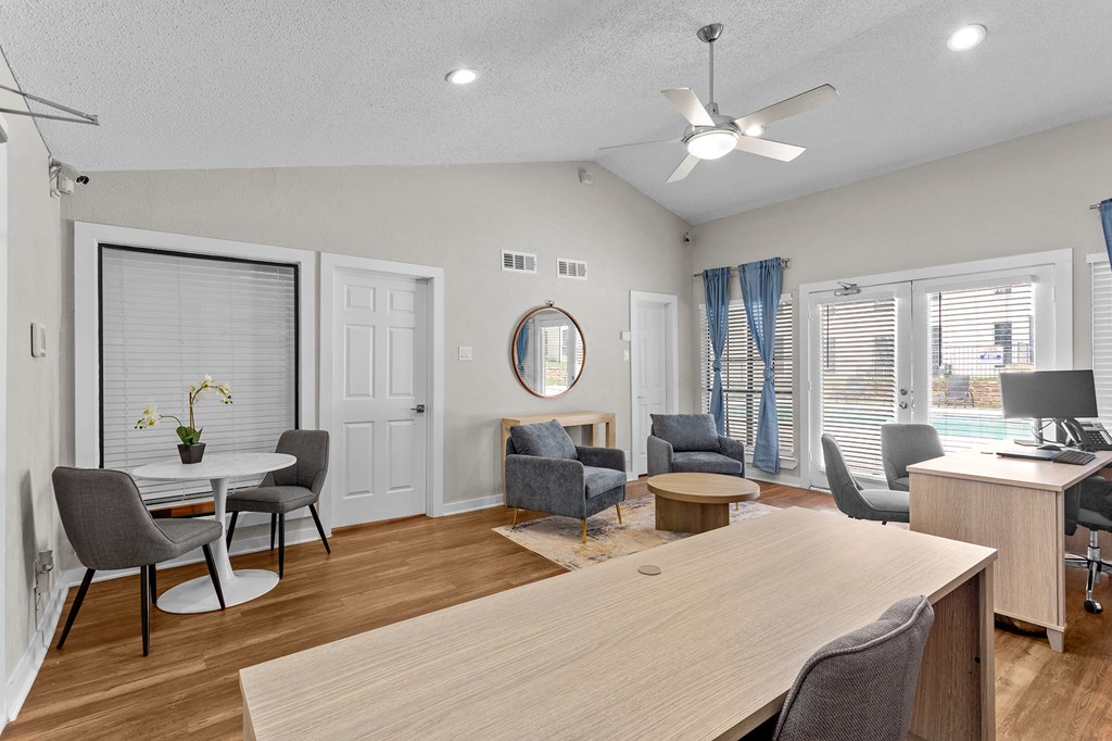 A room with a long table and chairs.
