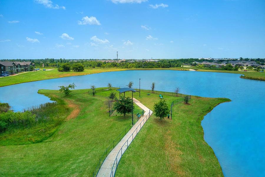 a walkway next to a body of water