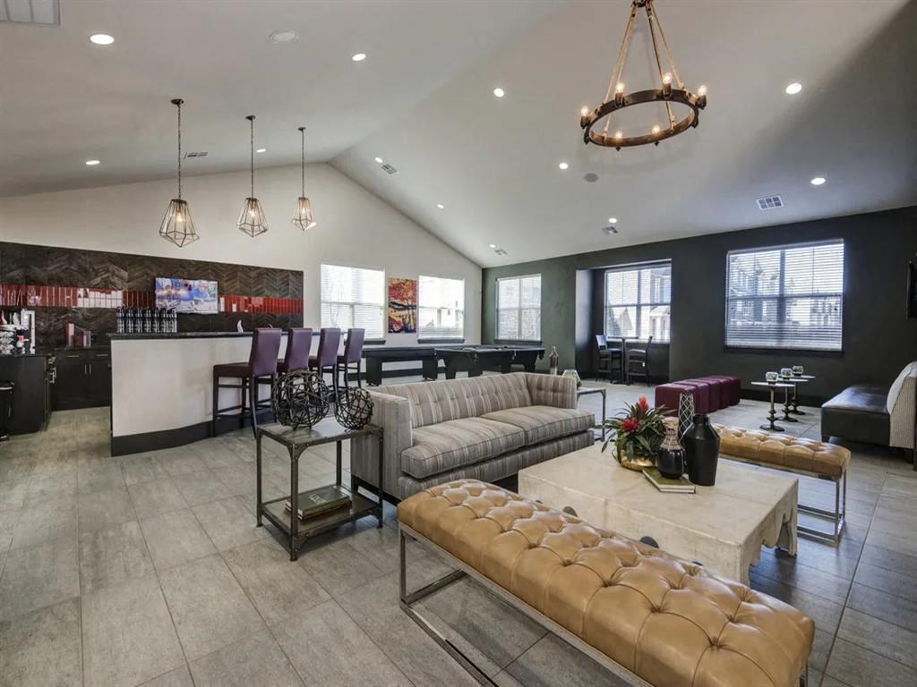 a lobby with couches and chairs and a bar