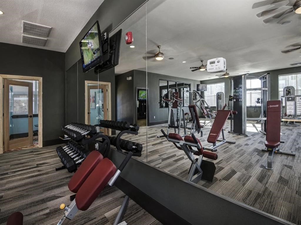 the gym at the flats at big tex apartments