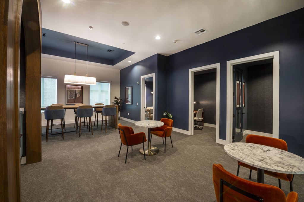 A room with a table and chairs in it.