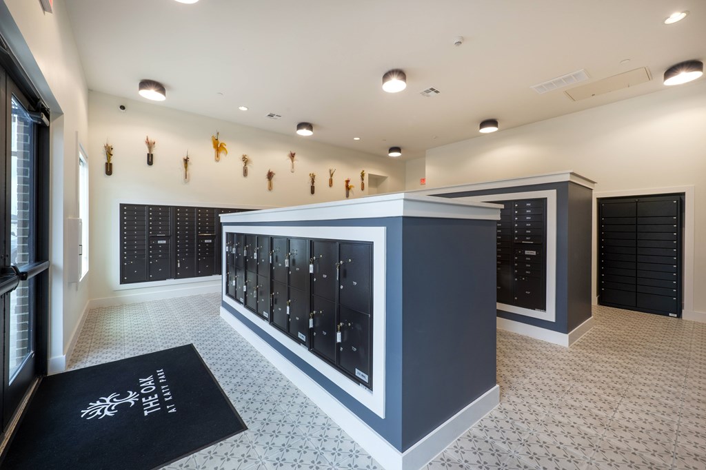 A modern room with a black and white color scheme and a row of lockers on the wall.