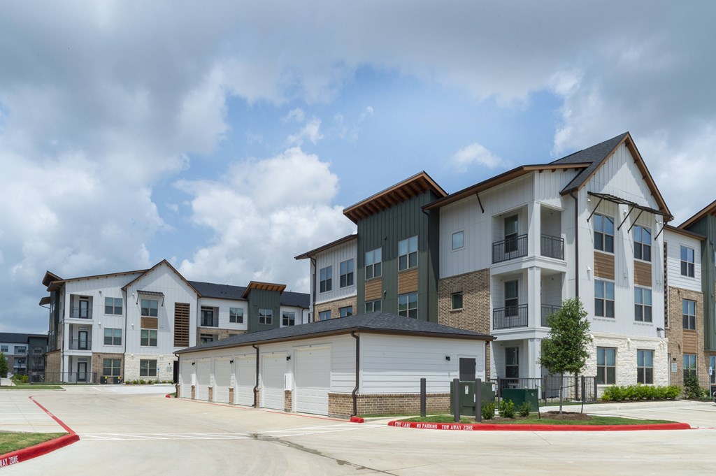 A large apartment complex with multiple buildings and garages.