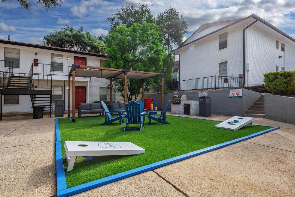 our apartments have an outdoor area with lawn furniture and a pool