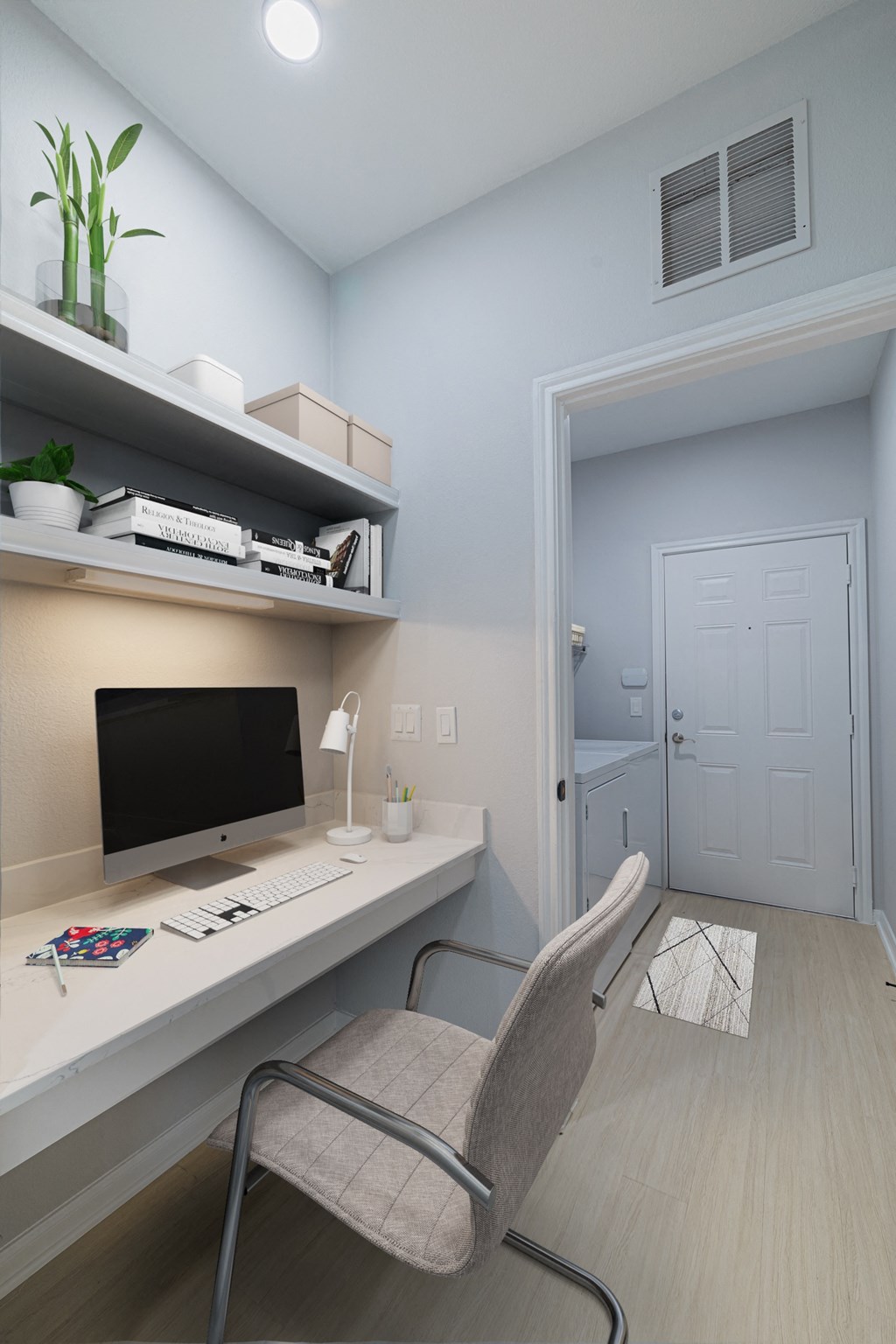 a home office with a computer desk and a chair