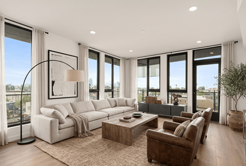 A modern living room with a large window and a view of the city.