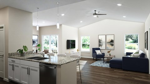 A modern kitchen with a large island and a living area with a couch.