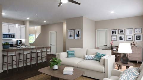 A living room with a white couch and a bar area.