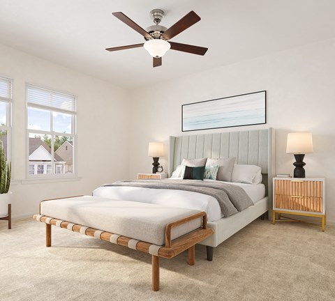 a bedroom with a bed and a ceiling fan