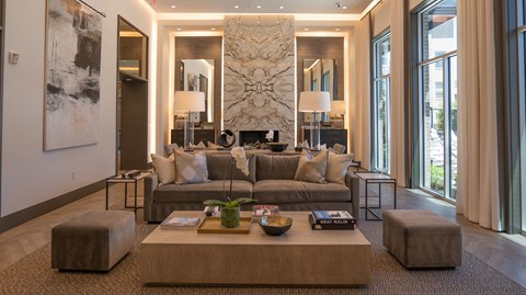 A living room with a large couch and a coffee table.