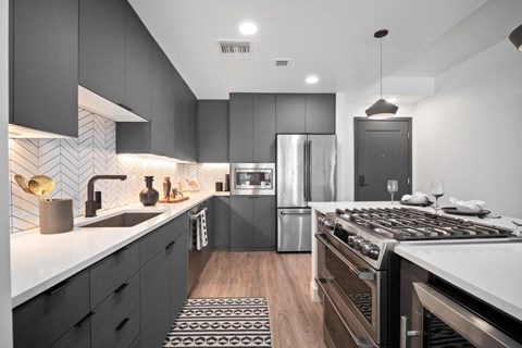a kitchen with a stove and a refrigerator