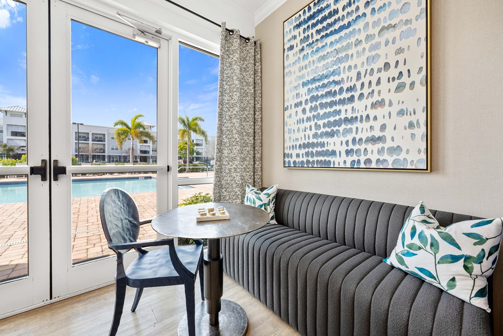 communal living room with a couch and a table and a pool