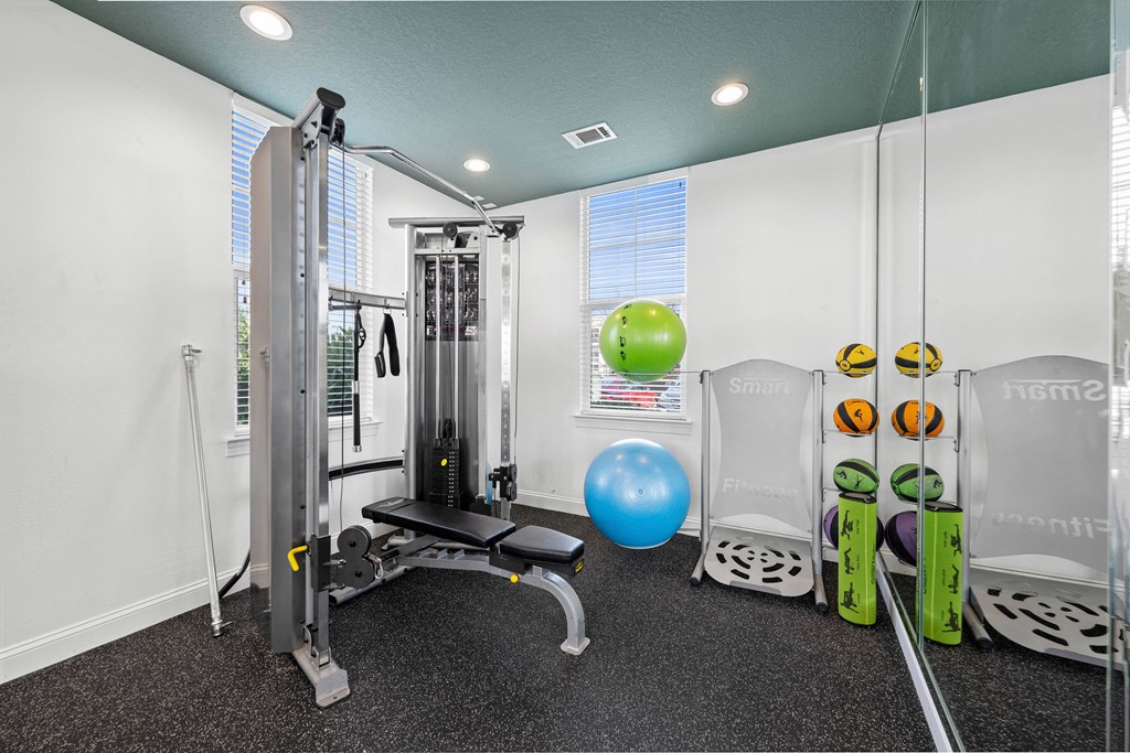 fitness room with exercise equipment