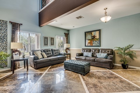 a living room with two couches and a table
