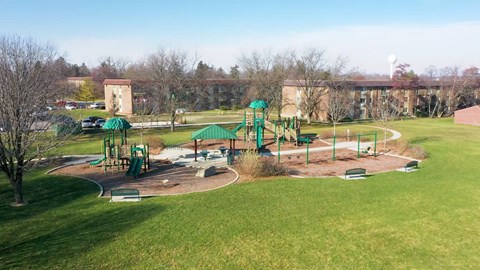 an aerial view of a playground in a park
