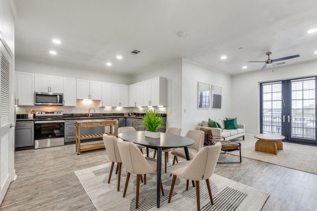 the preserve at ballantyne commons apartments clubhouse with dining table and kitchen