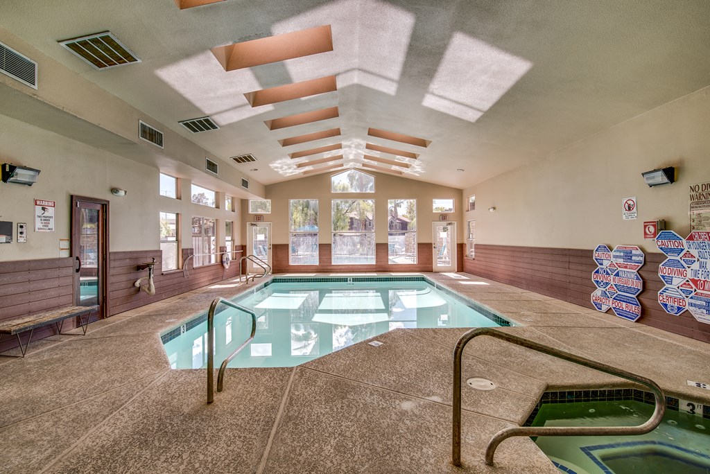a swimming pool in a lobby of a building with a pool