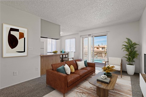 A living room with a brown couch and a painting on the wall.