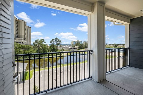a balcony with a view of a city and a river