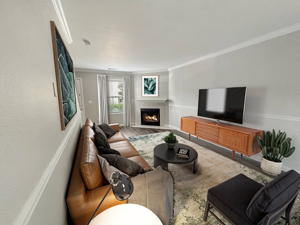 a living room with a leather couch and a tv