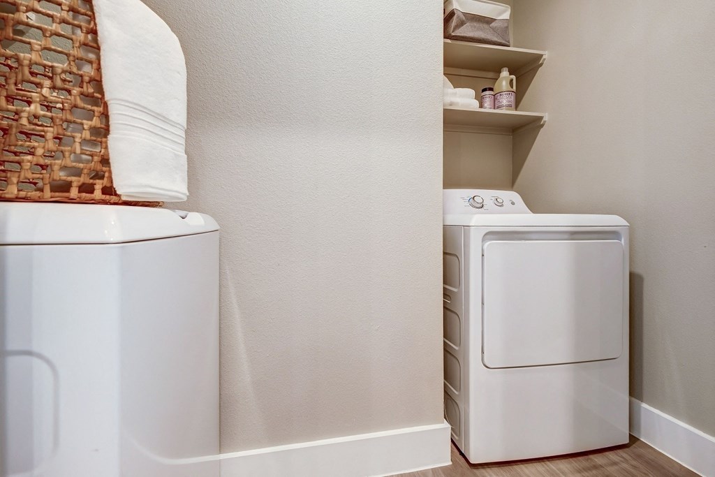 a small laundry room with a washer and dryer