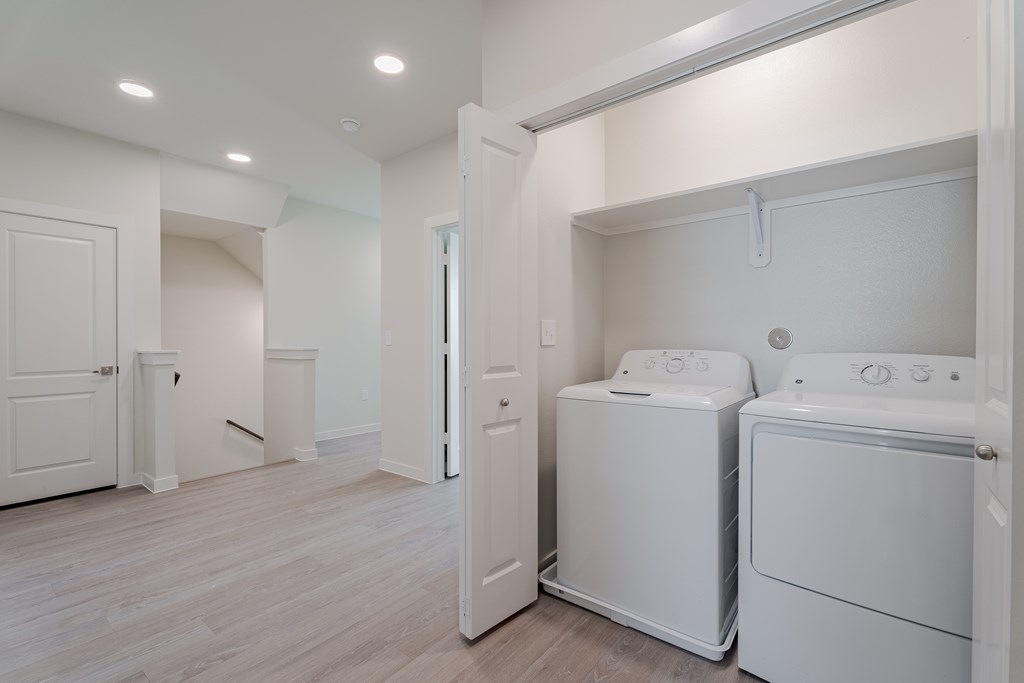 A laundry room with a washer and dryer.