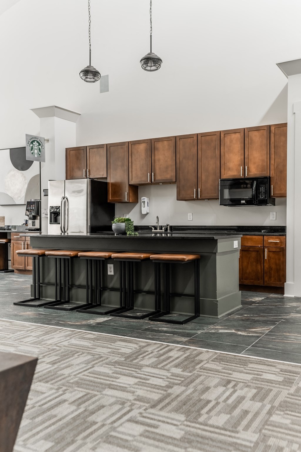 a kitchen with wooden cabinets and a black counter top