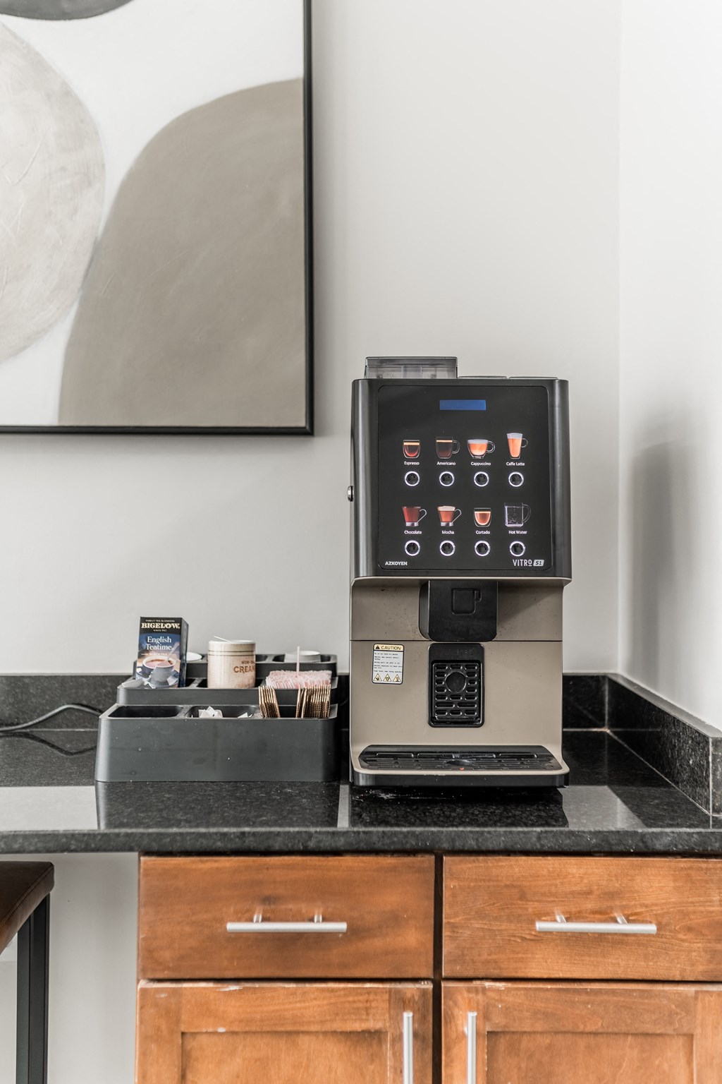 a coffee machine on a counter in a hotel room