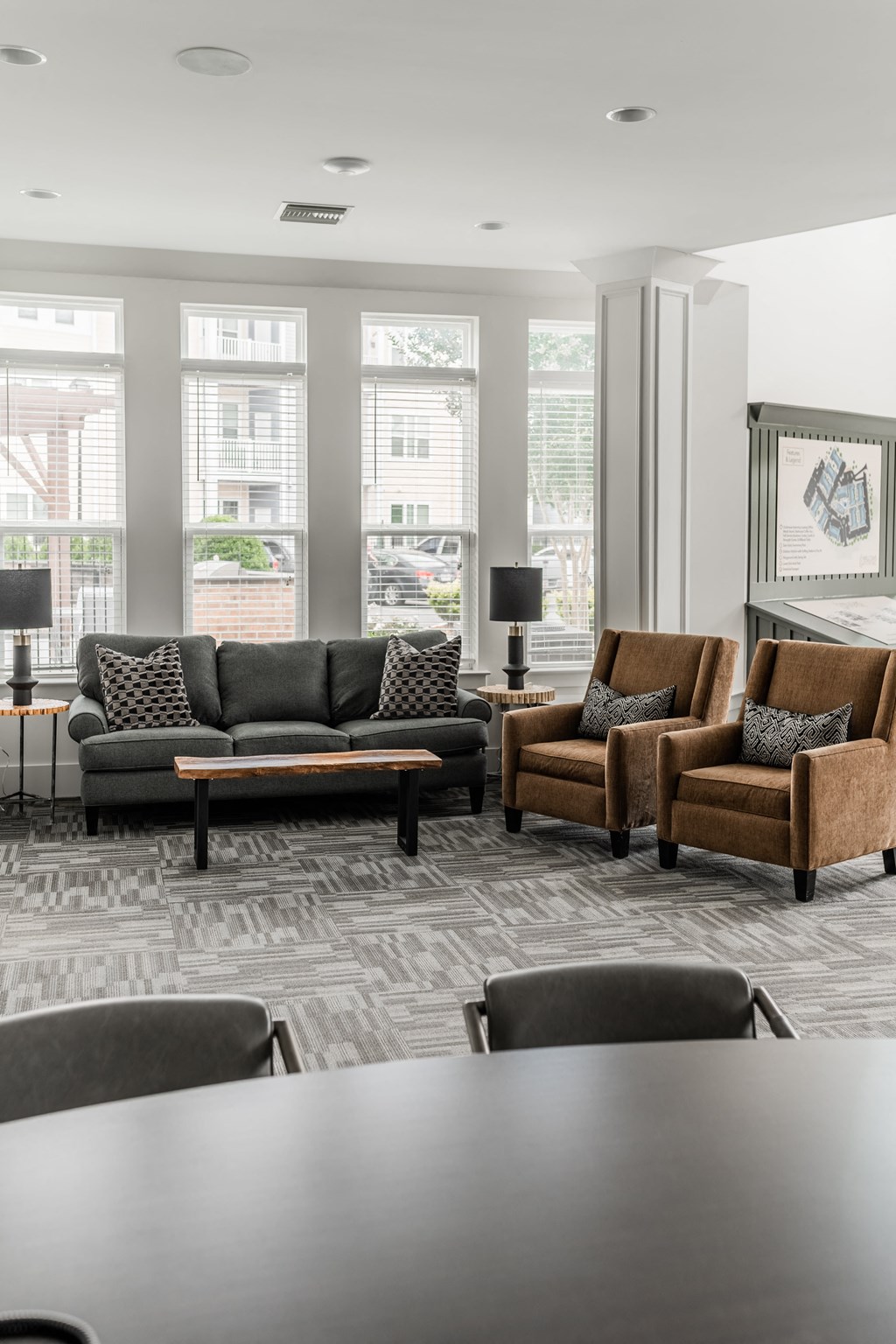 a living room with couches and chairs and a table