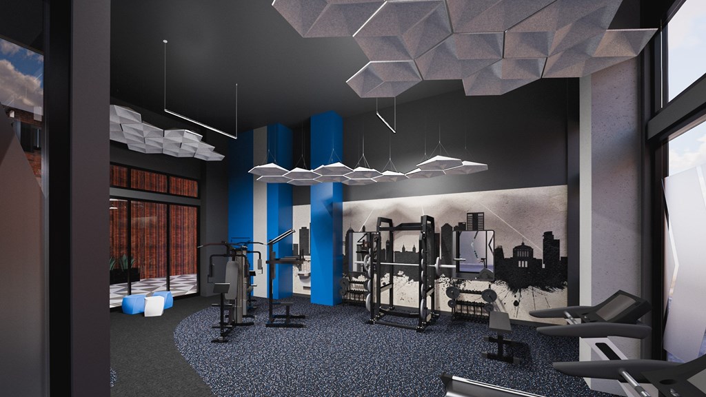 A gym with a variety of equipment including weights and machines.