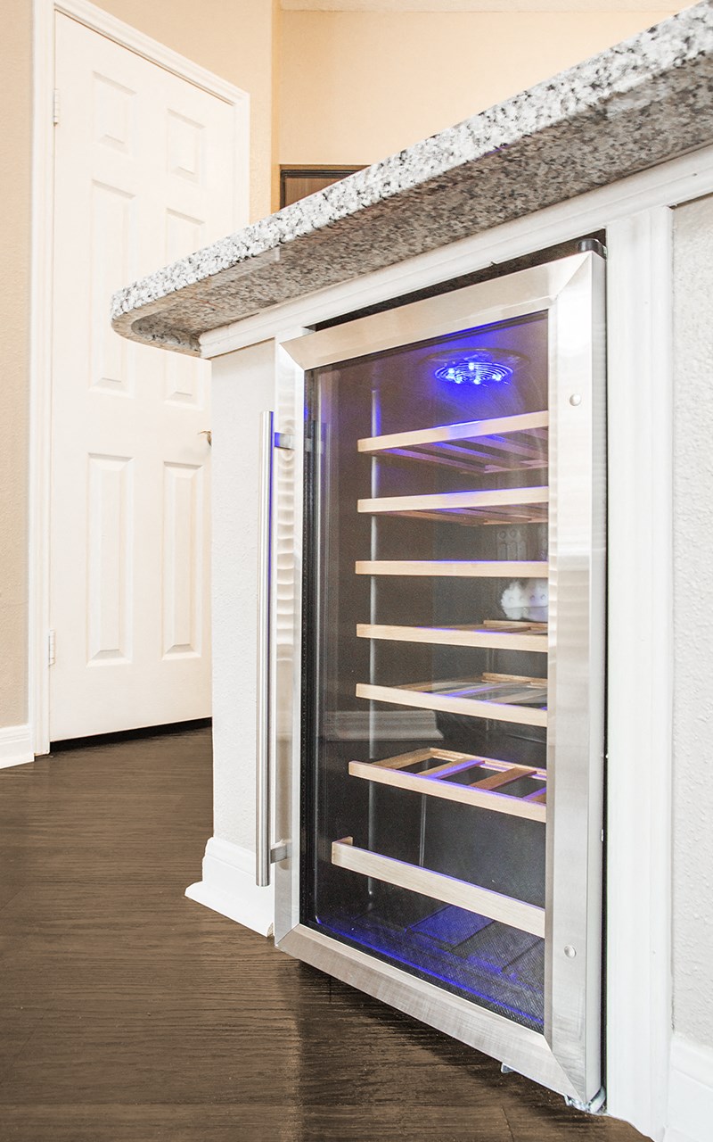 a refrigerator with its door open in a kitchen
