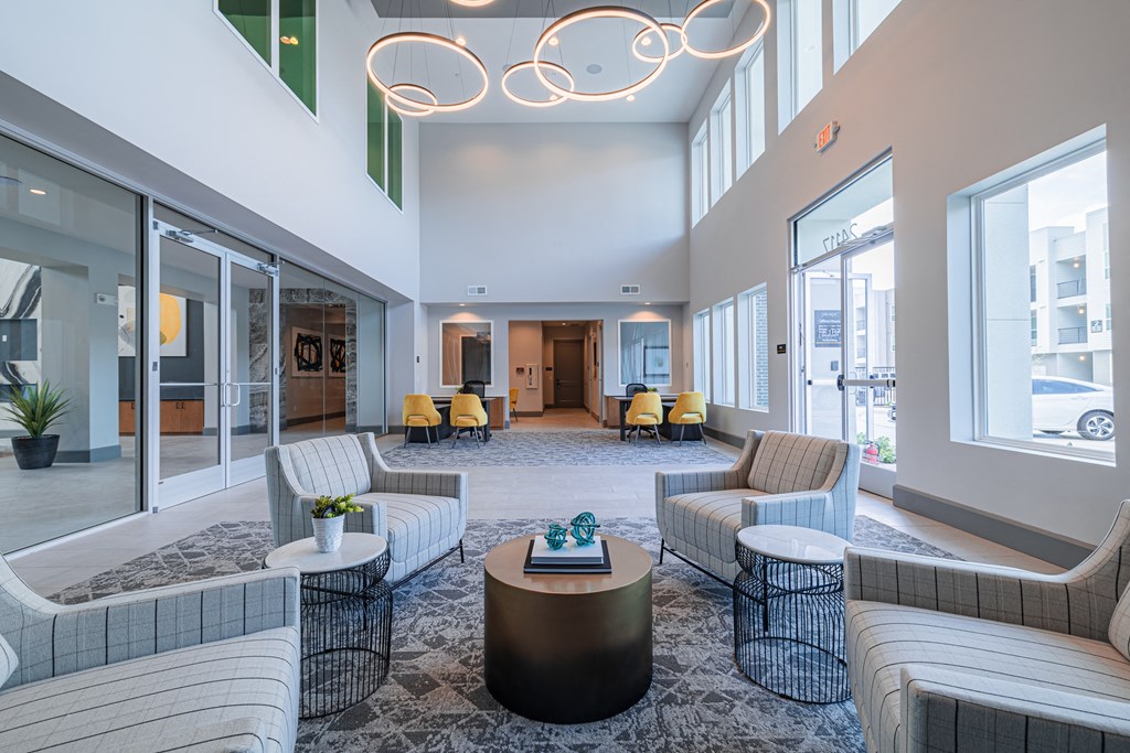 a lobby with couches and chairs and a coffee table