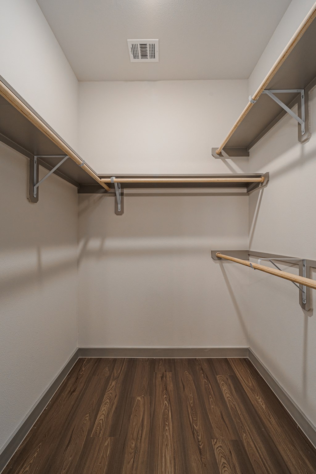 a spacious walk in closet in a 555 waverly unit