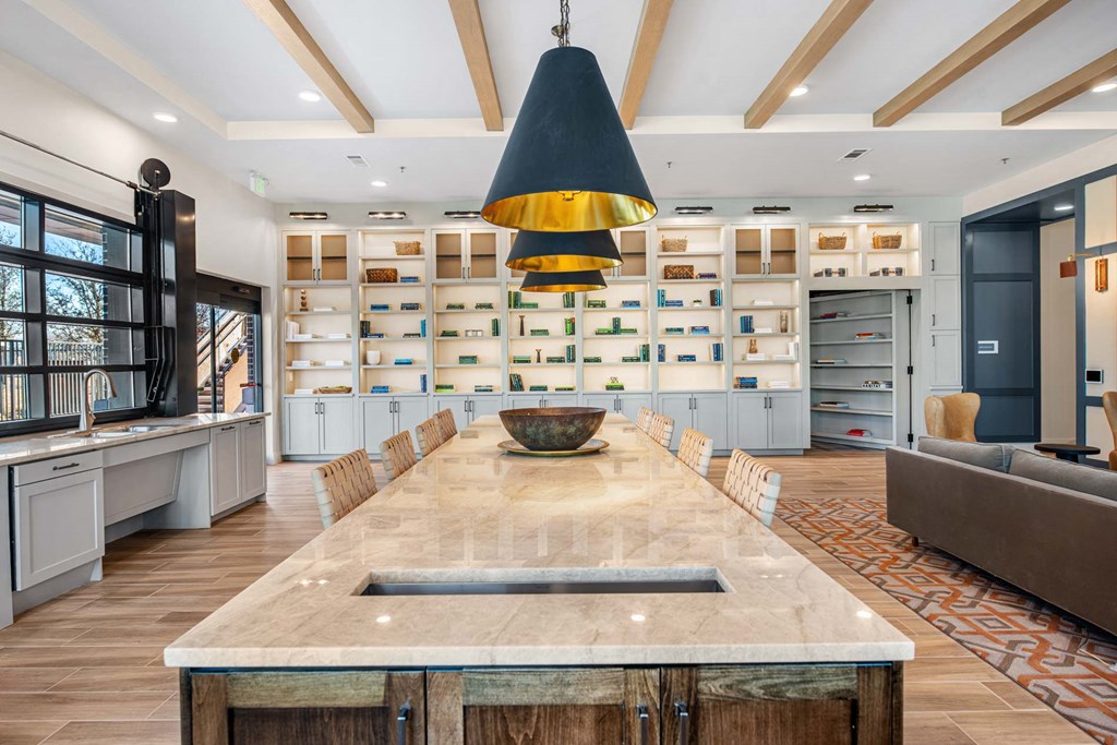 a large kitchen with a long island and a dining table