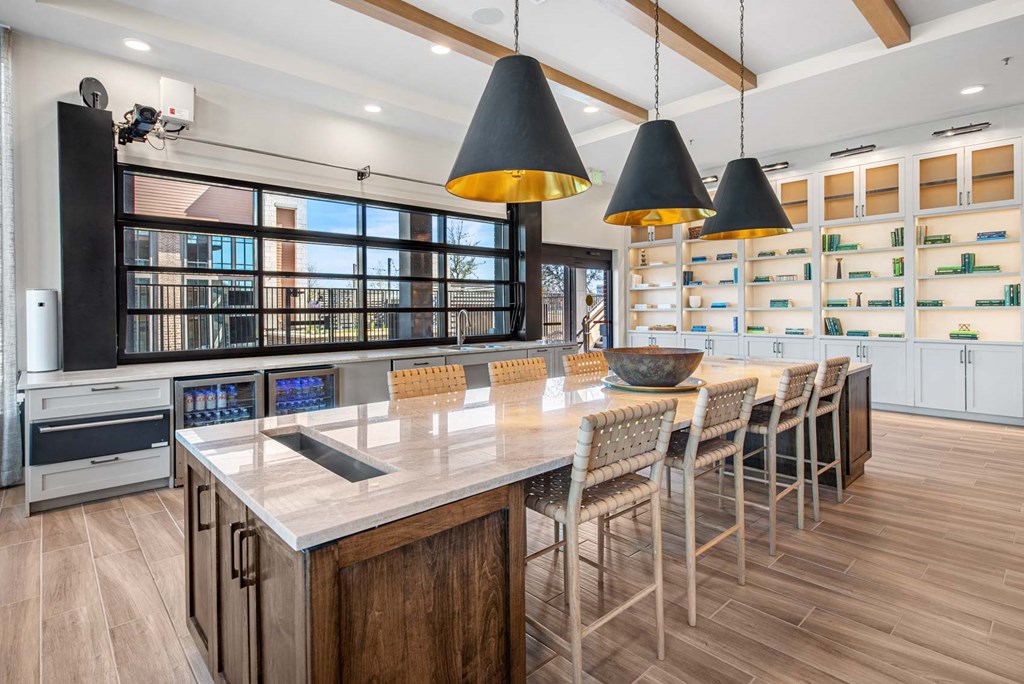 a large kitchen with a long table and chairs