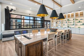 a large kitchen with a long table and chairs