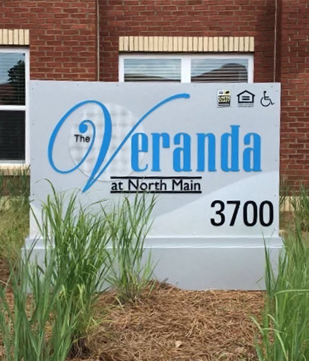 a sign in front of a building that reads the at north main
