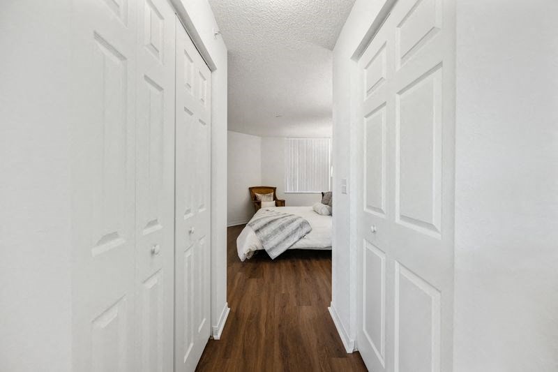 a bedroom with a bed and a closet