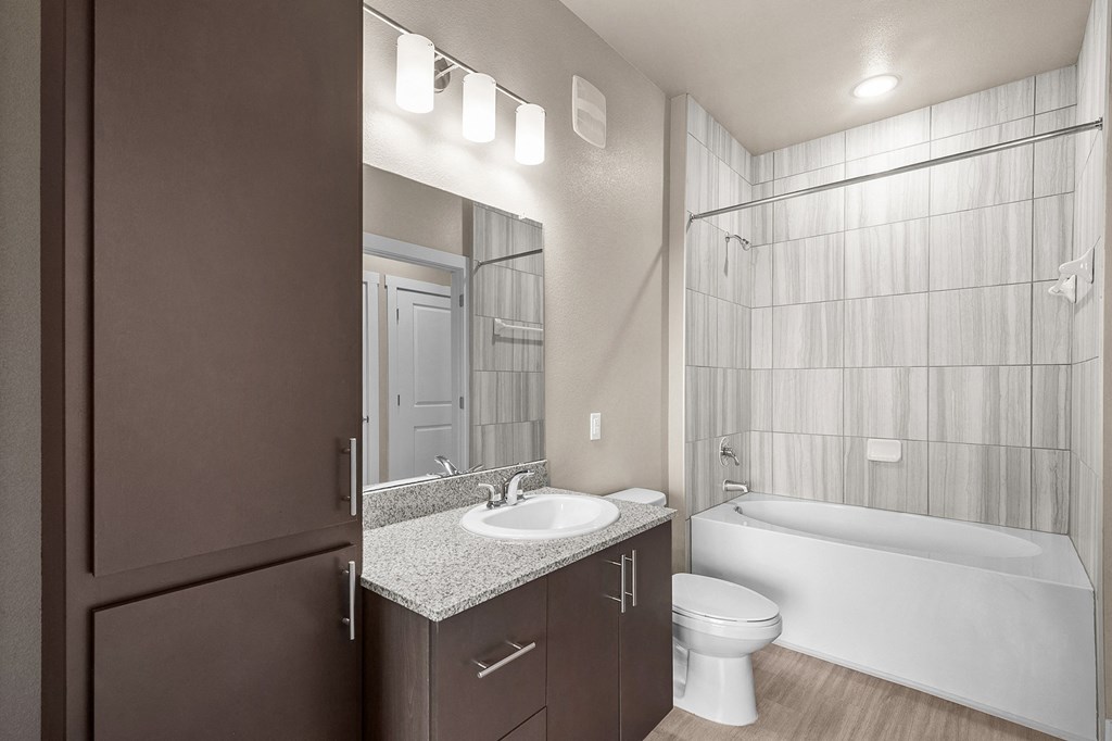 a bathroom with a sink toilet and a shower